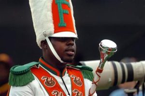 FILE - In this Nov. 19, 2011 file photo, Robert Champion, a drum major in Florida A&M University's Marching 100 band, performs during halftime of a football game in Orlando, Fla. The trial for four band members charged in the hazing death of Champion begins Monday, Oct. 27, 2014 in Orlando, Fla. (AP Photo/The Tampa Tribune, Joseph Brown III, File) 