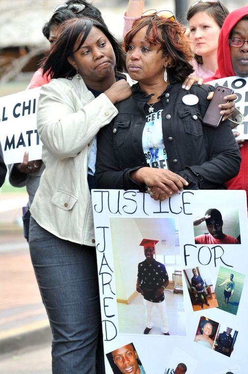 Zena Elam embraces her cousin Sebrina Elam during the Mother's March for Justice rally in front of the Buzz Westfall County Government Center in Clayton. About 300 supporters marched against violence in the community. Sebrina's son Jared Elam was found fatally shot in a field near the 4200 block of Obear in Sept. (Wiley Price/St. Louis American)