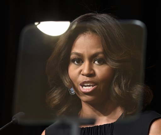 First lady Michelle Obama speaks at the Women Veterans Career Development Forum at the Women in Military Service for America Memorial (WIMSA) at Arlington National Cemetery in Arlington, Va., Monday, Nov. 10, 2014. (AP Photo/Susan Walsh)