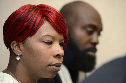 Lesley McSpadden, left, and Michael Brown, Sr., right, parents of teenager Michael Brown who was shot by a policeman in Ferguson, Missouri, speak during a press conference about the UN Committee Against Torture who convenes this week to evaluate the US government's compliance with the Convention Against Torture, in Geneva, Switzerland, Wednesday, Nov. 12, 2014. (AP Photo/Keystone, Martial Trezzini)