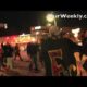 Ferguson protesters gather peacefully, holding signs and raising fists in solidarity with civil rights.