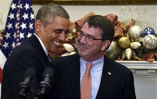 President Barack Obama shares a laugh with Ashton Carter, his nominee for defense secretary, Friday, Dec. 5, 2014, during the announcement in the Roosevelt Room of the White House in Washington.  (AP Photo/Susan Walsh)