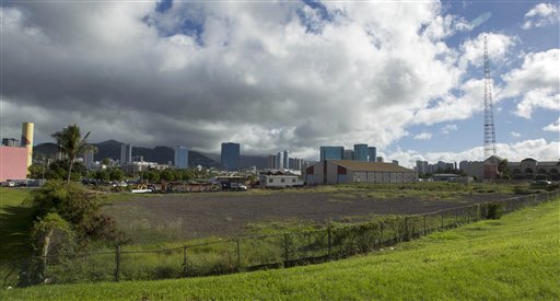 In this Dec. 24, 2013 file photo, one possible location in the Kakaako district of Honolulu to be considered for the Barack Obama Presidential Library. Four universities in Chicago, New York and Honolulu are trying to outdo one another as they compete to host Barack Obama's future presidential library. Each is offering primo real estate, major financial backing and a grand vision for what the library should look like, and next week, a handful of Obama's oldest friends will start picking the winner. A look at what each school is proposing. (AP Photo/Eugene Tanner)