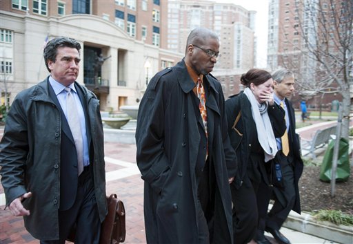 Former CIA officer Jeffrey Sterling, second from left, leaves the Alexandria Federal Courthouse Monday, Jan. 26, 2015, in Alexandria, Va., with his wife, Holly, second from right, attorney Barry Pollack, right, and attorney Edward MacMahon, after he was convicted on all nine counts he faced of leaking classified details of an operation to thwart Iran's nuclear ambitions to a New York Times reporter. (AP Photo/Kevin Wolf)