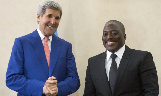 The president of the Democratic Republic of Congo, Joseph Kabila, right, welcomes the US secretary of state, John Kerry, to Kinshasa. (Saul Loeb/AP Photo)