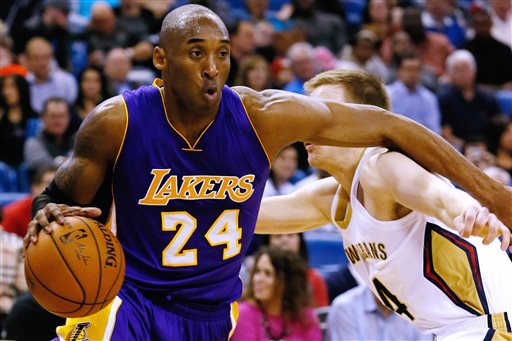 Los Angeles Lakers guard Kobe Bryant (24) drives against New Orleans Pelicans guard Nate Wolters, right, during the first half of an NBA basketball game, Wednesday, Jan. 21, 2015, in New Orleans. (AP Photo/Jonathan Bachman)