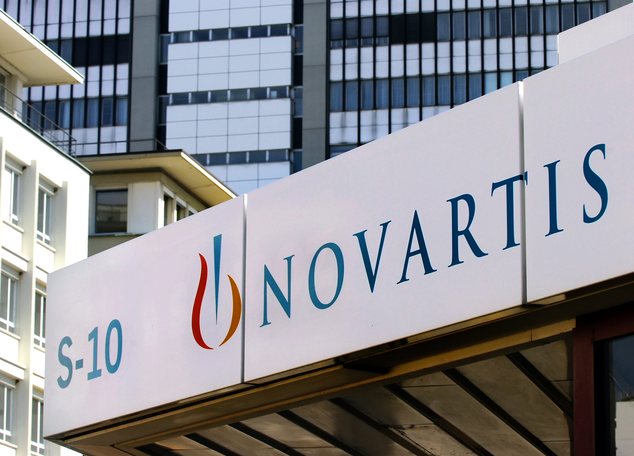 The Aug. 12, 2005 file photo shows the logo of Swiss company Novartis in Basel, Switzerland. Swiss pharmaceutical giant Novartis AG announced a series of multibillion-dollar deals Tuesday, April 22, 2014 with other major pharmaceutical companies that it said would reduce sales but boost profitability, while affecting some 15,000 of its employees globally. (AP Photo/Keystone, Steffen Schmidt)
