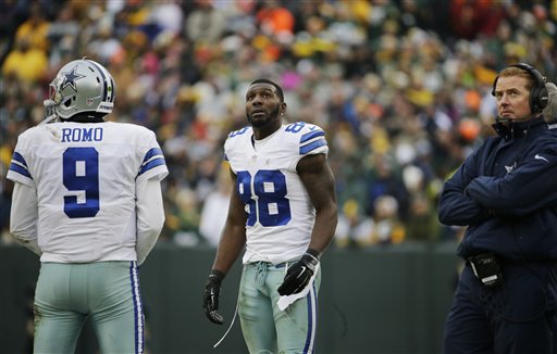 Dallas Cowboys wide receiver Dez Bryant (88) watches the scoreboard as officials review a catch by Bryant during the second half of an NFL divisional playoff football game Sunday, Jan. 11, 2015, in Green Bay, Wis. The call was reversed. (AP Photo/Nam Y. Huh)