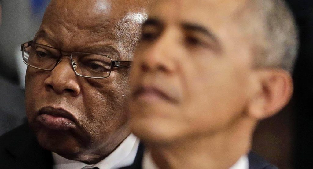 Rep. John Lewis, D-Ga., sits behind President Barack Obama at a memorial ceremony for the late former Speaker of the House of Representatives Thomas S. Foley at the Statuary Hall on Capitol Hill in Washington, Tuesday, Oct. 29, 2013. (AP Photo/Pablo Martinez Monsivais)