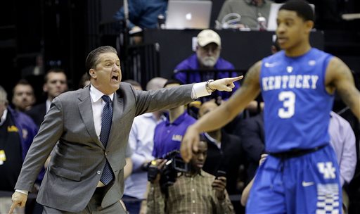Kentucky head coach John Calipari calls out from the bench in the second half  half of an NCAA college basketball game against LSU in Baton Rouge, La., Tuesday, Feb. 10, 2015.  Kentucky won 71-69. (AP Photo/Gerald Herbert)