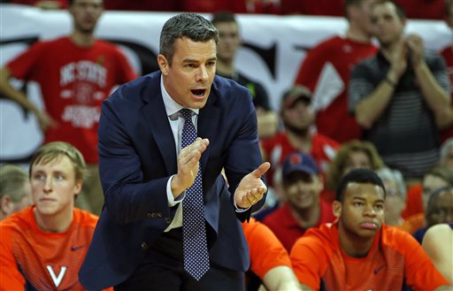 Virginia head coach Tony Bennett instructs from the sidelines during the first half of an NCAA college basketball game against the NC State in Raleigh, N.C., Wednesday, Feb. 11, 2015. (AP Photo/Karl B DeBlaker)