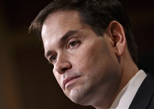 FILE - In this Dec. 17, 2014 file photo, Sen. Marco Rubio, R-Fla. speaks on Capitol Hill in Washington, Wednesday, Dec. 17, 2014. In 2002, then-Sen. Hillary Rodham Clinton took a vote in favor of the Iraq war that would come to haunt her presidential prospects. Now, a new generation of senators weighing White House bids _ Marco Rubio, Rand Paul and Ted Cruz _ will have to make a similar choice about President Barack Obamas use of force request. Clinton, too, will face questions about her position on Obamas proposal, but this time has the advantage of avoiding an actual vote on the Senate floor.  (AP Photo/J. Scott Applewhite, File)