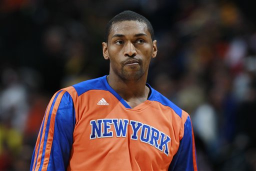 This is a Friday, Nov. 29, 2013 file photo of  the then New York Knicks forward Metta World Peace as he warms up before facing the Denver Nuggets in the first quarter of an NBA basketball game in Denver. Metta World Peace has signed for Italian team Pallacanestro Cantu for the remainder of the season. After a series of teasing tweets from World Peace, Cantu has confirmed the news, calling it "the coup of the century." (AP Photo/David Zalubowski, File)