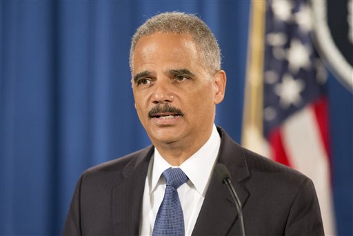 In this Sept. 4, 2014, file photo, Attorney General Eric Holder speaks during a news conference at the Justice Department in Washington to announce the Justice Department's civil rights division will launch a broad civil rights investigation in the Ferguson, Mo., Police Department. City officials in Ferguson, Missouri, are pledging their full cooperation with a federal civil-rights investigation into their police department following the death of 18-year-old Michael Brown. Six months after 18-year-old Michael Brown died in the street in Ferguson, Missouri, the Justice Department is close to announcing its findings in the racially charged police shooting that launched "hands up, don't shoot" protests across the nation. (AP Photo/Pablo Martinez Monsivais, File)
