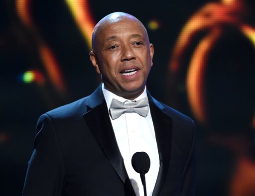 In this Feb. 6, 2015 file photo, Russell Simmons presents the Vanguard Award on stage at the 46th NAACP Image Awards in Pasadena, Calif.  Simmons is producing a brand new stage musical that will celebrate three generations of hip-hop, from Run DMC to Kanye West. Simmons  said Thursday, March 19, 2015, that The Scenario will feature an original story written by author and hip-hop historian Dan Charnas and aims to premiere in New York City in late 2016. (Photo by Chris Pizzello/Invision/AP, File)
