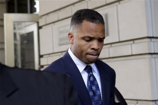 In this Aug. 14, 2013, file photo, former Illinois Rep. Jesse Jackson Jr., leaves federal court in Washington after being sentenced to 2 1/2 years in prison for misusing $750,000 in campaign funds. Jackson Jr. will be released from a federal prison on Thursday, March 26, 2015, and will serve out the remainder of his term in a Washington, D.C., halfway house, former U.S. Rep. Patrick Kennedy told The Associated Press after visiting Jackson behind bars. (AP Photo/Susan Walsh, File)