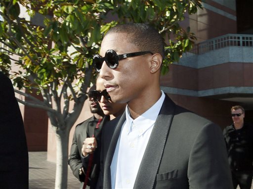 Pharrell Williams leaves Los Angeles Federal Court after testifying at trial in Los Angeles, Wednesday, March 4, 2015. The Grammy-winning singer Williams says he wasn't trying to copy the late Marvin Gaye's music for the hit song "Blurred Lines," but he was trying to evoke the feeling of late 1970s tunes. Williams is being sued by Gaye's children, who claim "Blurred Lines" improperly copies their father's hit "Got to Give it Up." Singer Robin Thicke and rapper T.I. are also defendants in the case. (AP Photo/Nick Ut)