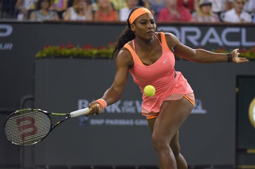 Serena Williams returns to Monica Niculescu, of Romania, in a match at the BNP Paribas Open tennis tournament, Friday, March 13, 2015, in Indian Wells, Calif. (AP Photo/Mark J. Terrill)