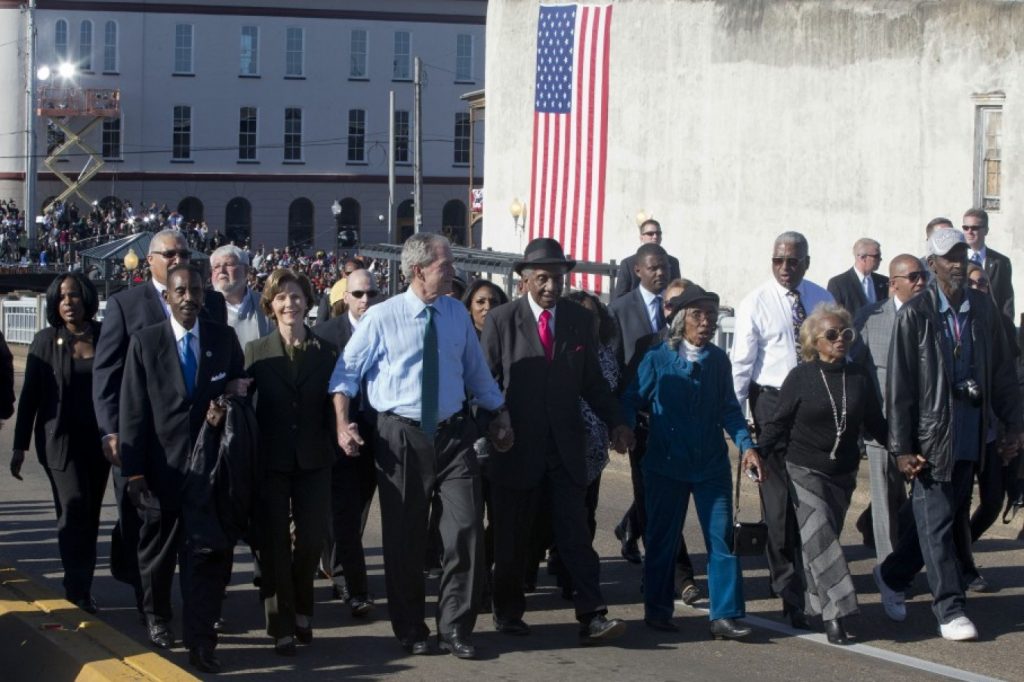 Laura Bush, second from left, and former President George W. Bush, as well as members of Congress and civil rights leaders make a symbolic walk across the Edmund Pettus Bridge in Selma, Ala., for the 50th anniversary of “Bloody Sunday,” a landmark event of the civil rights movement, Saturday, March 7, 2015. (AP Photo/Jacquelyn Martin)