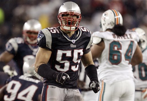 In this Dec. 23, 2007, file photo, New England Patriots linebacker Junior Seau (55) reacts after a defensive play during an NFL football game against the Miami Dolphins in Foxborough, Mass. A federal judge has approved Wednesday, April 22, 2015, a plan to resolve thousands of NFL concussion lawsuits that could cost the league $1 billion over 65 years. Critics contend the NFL is getting off lightly given annual revenues of about $10 billion About 200 NFL retirees or their families, including Seau's, have rejected the settlement and plan to sue the league individually. (AP Photo/Elise Amendola, File)