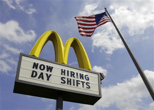 This May 2, 2012, file photo shows a sign advertising job openings outside a McDonalds restaurant in Chesterland, Ohio. McDonald's on Wednesday, April 1, 2015 said it's raising pay for workers at its company-owned U.S. restaurants, making it the latest employer to sweeten worker incentives in an improving economy. (AP Photo/Amy Sancetta, File)