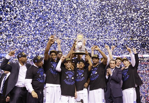 Duke players celebrate with the trophy after their 68-63 victory over Wisconsin in the NCAA Final Four college basketball tournament championship game Monday, April 6, 2015, in Indianapolis. (AP Photo/David J. Phillip)