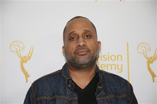 In this Jan. 28, 2015 file photo, Creator and Executive producer of "Black-ish," Kenya Barris, poses on the red carpet at "An Evening with Norman Lear," presented by the Television Academy at the Montalban Theatre in the Hollywood section of Los Angeles. Barris is set to write the screenplay for a "Good Times" film based on the hit '70s sitcom, his manager confirmed Monday, April 26, 2015, to The Associated Press. "Good Times," which aired on CBS from 1974 to 1979, was about an African-American family living in a poor neighborhood in Chicago. (Danny Moloshok/Television Academy via AP, File)