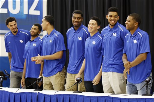 From left, Kentucky NCAA college basketball players Willie Cauley-Stein, Andrew Harrison, Trey Lyles, Dakari Johnson, Devon Booker, Karl-Anthony Towns and Aaron Harrison stand during a news conference where they announced their intent to place their names in the NBA draft at the Joe Craft Center, Thursday, April 9, 2015, in Lexington, Ky. (AP Photo/James Crisp)