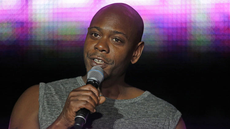 Santa Fe police say a man tossed a banana peel at Dave Chappelle during a show, hitting the comedian in the leg. Above, Chappelle performs in New Orleans in July 2014. (Gerald Herbert/AP Photo)