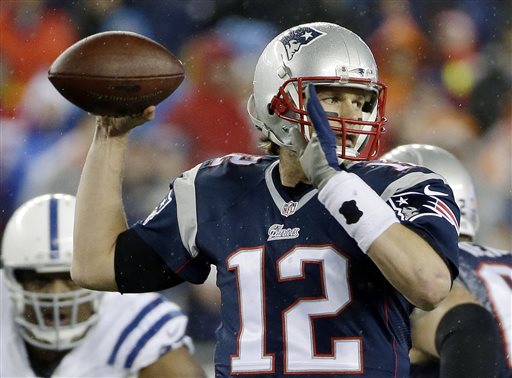 In this Jan. 18, 2015, file photo, New England Patriots quarterback Tom Brady looks to pass during the first half of the NFL football AFC Championship game against the Indianapolis Colts  in Foxborough, Mass. The NFL suspended Brady for the first four games on Monday, May 11, 2015, for his role in a scheme to deflate footballs used in the AFC title game. (AP Photo/Matt Slocum, File)