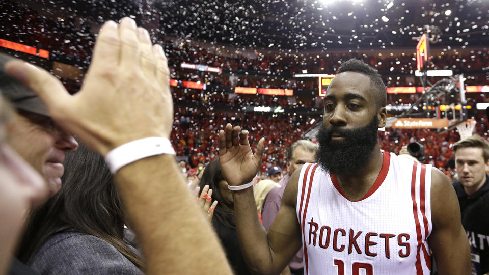 Houston Rockets' James Harden (13) celebrates after defeating the Los Angeles Clippers 113-100 in Game 7 of the NBA basketball Western Conference semifinals, Sunday, May 17, 2015, in Houston. (AP Photo/David J. Phillip)