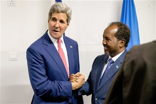 Secretary of State John Kerry meets with President Hassan Sheikh Mohammed, right, at the airport in Mogadishu, Somalia, Tuesday, May 5, 2015, in a show of solidarity with the Somalian government trying to defeat to al-Qaida-allied militants and end decades of war in the African country. He is the first secretary of state to ever to visit the country. (AP Photo/Andrew Harnik, Pool)