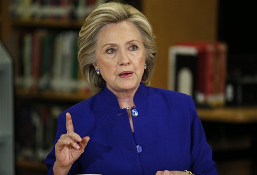 In this May 5, 2015, photo, Democratic presidential candidate Hillary Rodham Clinton speaks on immigration at an event at Rancho High School in Las Vegas. To judge them solely by their travels over the past month, you might think Jeb Bush has already plunged into the general election and Clinton has a serious fight on her hands for the Democratic nomination.  (AP Photo/John Locher)