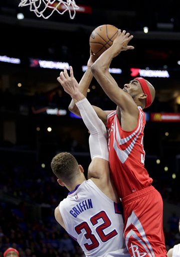 Houston Rockets guard Corey Brewer, right, shoots over Los Angeles Clippers forward Blake Griffin during the second half of Game 6 in a second-round NBA basketball playoff series in Los Angeles, Thursday, May 14, 2015. (AP Photo/Jae C. Hong)