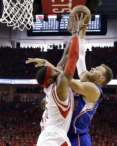 Houston Rockets forward Josh Smith (5) blocks a shot by Los Angeles Clippers forward Blake Griffin (32) during the second half in Game 7 of the NBA basketball Western Conference semifinals Sunday, May 17, 2015, in Houston. (AP Photo/David J. Phillip)