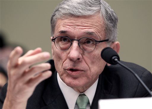 In this March 17, 2015 file photo, Federal Communications Commisison (FCC) Chairman Tom Wheeler testifies before the House Oversight and Government Reform Committee hearing on net neutrality on Capitol Hill in Washington.  Wheeler is proposing that the FCC expand a phone subsidy program for the poor to include Internet access. (AP Photo/Lauren Victoria Burke, File)