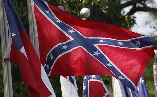 In this July 19, 2011 file photo, Confederate battle flags fly outside the museum at the Confederate Memorial Park in Mountain Creek, Ala., Tuesday, July 19, 2011. Major retailers are halting sales of the Confederate flag after the June 17, 2015 shooting deaths of nine black church members in South Carolina. (AP Photo/Dave Martin, File)