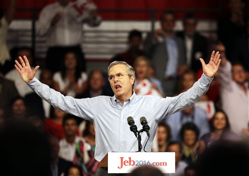 Former Florida Gov. Jeb Bush waves to the crowd as he formally joins the race for president with a speech at Miami Dade College, Monday, June 15, 2015, in Miami. (AP Photo/David Goldman)