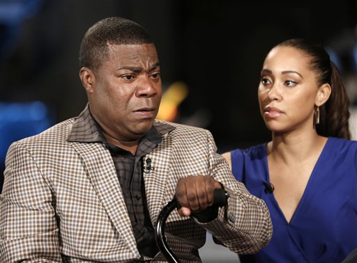 In this photo provided by NBC, actor and comedian Tracy Morgan, left, and fiancee Megan Wollover appear in an interview with Matt Lauer during taping for tonight's Nightly News, Monday, June 1, 2015, in New York.  Morgan spoke out for the first time since his tragic June 2014, car accident. The comedian discussed his memories of the accident, his struggle to recover, and his outlook for the future. (Peter Kramer/NBC News via AP)