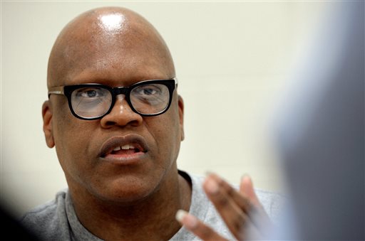 In an Tuesday, Aug. 26, 2014 file photo, Leon Brown speaks with a reporter at the Maury Correctional Institution in Maury, N.C., about his incarceration. Brown and his half-brother Henry McCollum were pardoned Thursday, June 4, 2015, by Gov. Pat McCrory in the 1983 rape and killing of a girl, clearing the way for them to each receive $750,000 in compensation from the state. McCrory's pardons for McCollum and his Brown came months after a judge vacated their convictions and ordered their release, citing new DNA evidence that points to another man killing and raping 11-year-old Sabrina Buie. (Chuck Liddy/The News & Observer via AP, File)
