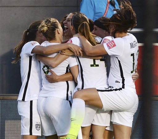 U.S. players celebrate a goal by Carli Lloyd (10) against China during the second half of a quarterfinal match in the FIFA Women's World Cup soccer tournament, Friday, June 26, 2015, in Ottawa, Ontario, Canada. (Sean Kilpatrick/The Canadian Press via AP)