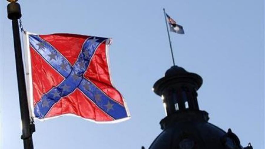 A Confederate flag flies atop the north end of the South Carolina Statehouse in Columbia (AP Photo)