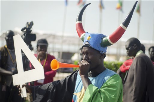 A South Sudanese man blows a horn as he attends an independence day ceremony in the capital Juba, South Sudan, Thursday, July 9, 2015. South Sudan marked four years of independence from Sudan on Thursday, but the celebrations were tempered by concerns about ongoing violence and the threat of famine. (AP Photo/Jason Patinkin)