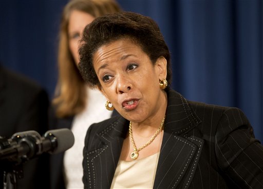 In this June 18, 2015, file photo, Attorney General Loretta Lynch speaks at a news conference at the Justice Department in Washington. Lynch announced that Dylann Roof, the man accused of slaying of nine black church members in Charleston last month was indicted July 22, on 33 federal counts, including hate crimes, firearms violations and obstructing the practice of religion, which could include the death penalty. (AP Photo/Pablo Martinez Monsivais, File)