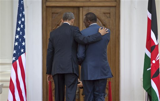 President Barack Obama, left, puts his arm on the shoulder of Kenya's President Uhuru Kenyatta, right, as the two leave after speaking to the media at State House in Nairobi, Kenya Saturday, July 25, 2015. (AP Photo/Ben Curtis)