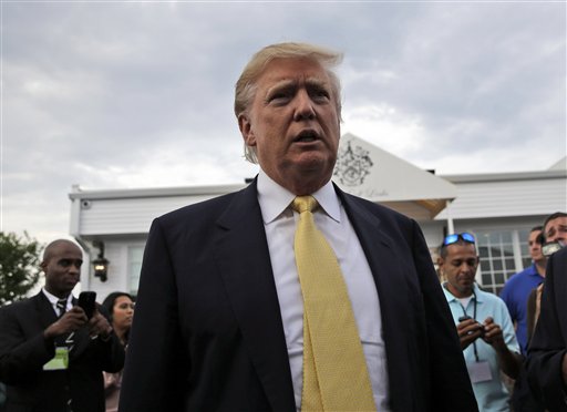 Republican presidential candidate Donald Trump arrives at a fundraising event at a golf course in the Bronx borough of New York, Monday, July 6, 2015. (AP Photo/Seth Wenig)