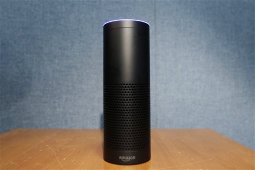 Amazon's Echo, a digital assistant that can be set up in a home or office to listen for various requests, such as for a song, a sports score, the weather, or even a book to be read aloud, is shown, Wednesday, July 29, 2015 in New York. The $180 cylindrical device is the latest advance in voice-recognition technology that's enabling machines to record snippets of conversation that are analyzed and stored by companies promising to make their customers' lives better. (AP Photo/Mark Lennihan)