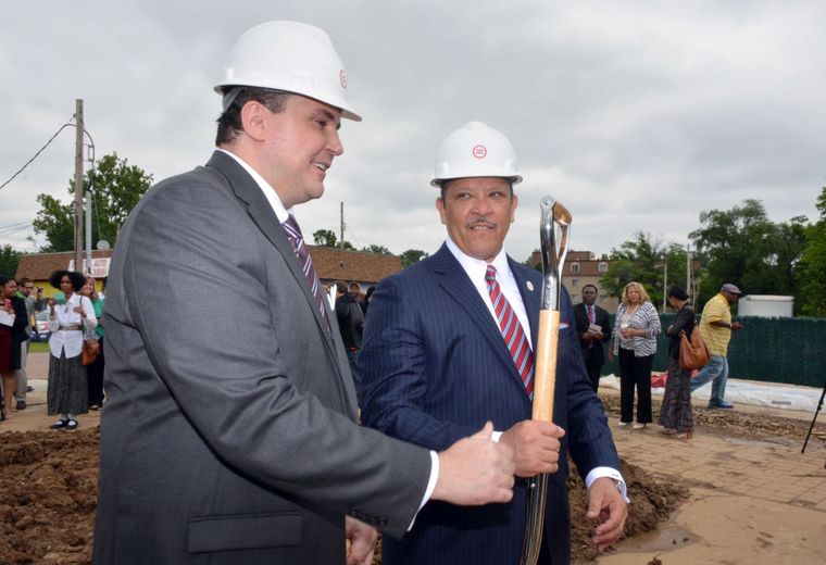 Michael McMillan, president and CEO of the Urban League of Metropolitan St. Louis, wielded a shovel alongside Marc Morial, president and CEO of the National Urban League, at the groundbreaking for a new community center at the site of the burnt-out QuikTrip in Ferguson. (Wiley Price/St. Louis American)