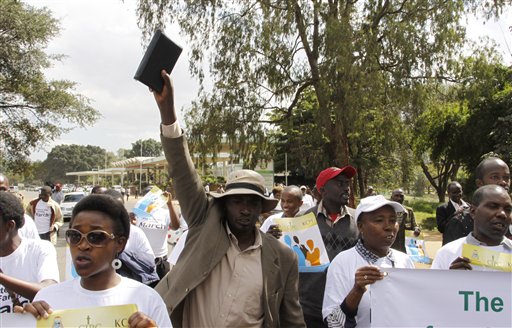 Members of various Christian groups march during a protest against gay and same sex unions in Nairobi, Kenya, Monday, July 6, 2015. A demonstration against homosexuality in Kenya has fizzled after attracting only a handful of protesters. The demonstration by about 35 people Monday was called by the Evangelical Alliance of Kenya and timed to coincide with the visit later this month of U.S. President Barack Obama. The group is calling on Obama not to advocate for gay rights during his visit to Africa July 24-28. (AP Photo/ Khalil Senosi)