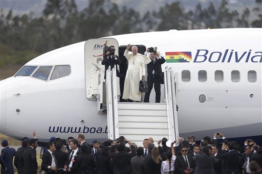 Pope Francis waves goodbye as he prepares to depart Mariscal Sucre airport in Quito, Ecuador, Wednesday, July 8, 2015. The pope is departing for Bolivia, as part of his three-nation South American tour. (AP Photo/Dolores Ochoa)
